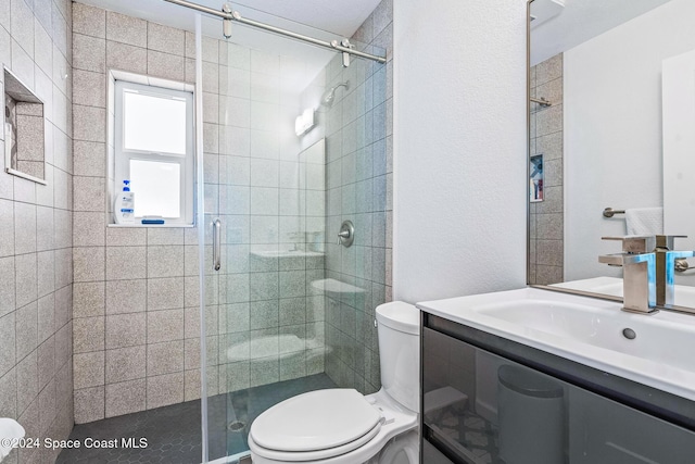 154 21st St SW, Vero Beach, FL 32962 - bathroom featuring toilet, vanity, and a stall shower