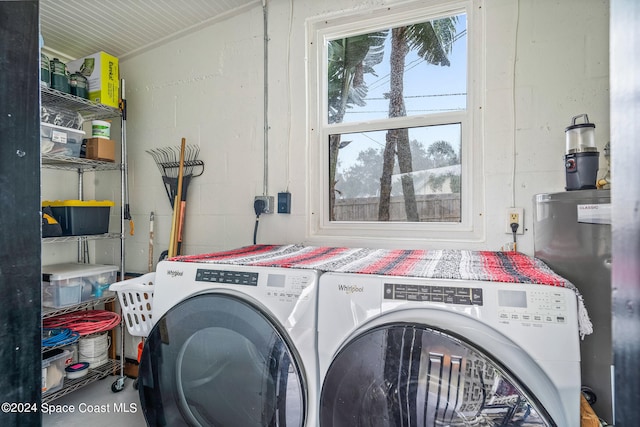 washroom with independent washer and dryer and water heater