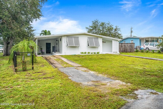 154 21st St SW, Vero Beach, FL 32962 - single story home featuring fence, driveway, a front yard, and stucco siding