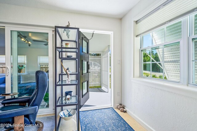 154 21st St SW, Vero Beach, FL 32962 - doorway to outside featuring baseboards