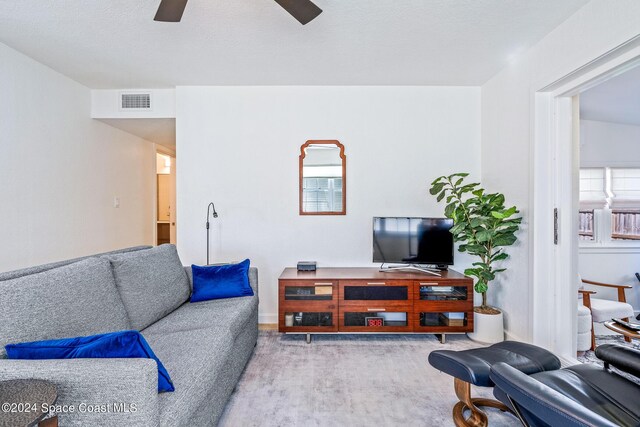 154 21st St SW, Vero Beach, FL 32962 - living area with visible vents, carpet flooring, and ceiling fan