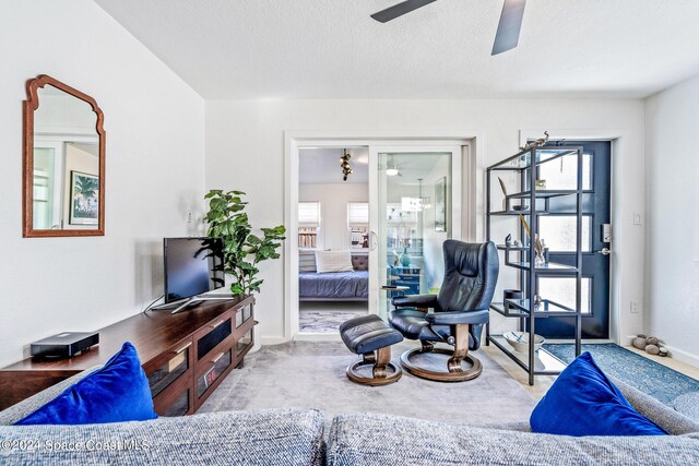 154 21st St SW, Vero Beach, FL 32962 - carpeted living area with a ceiling fan and baseboards