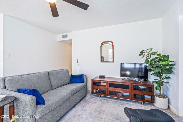 154 21st St SW, Vero Beach, FL 32962 - living area featuring visible vents, a ceiling fan, and baseboards