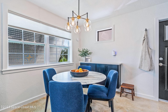 154 21st St SW, Vero Beach, FL 32962 - dining room with baseboards and an inviting chandelier