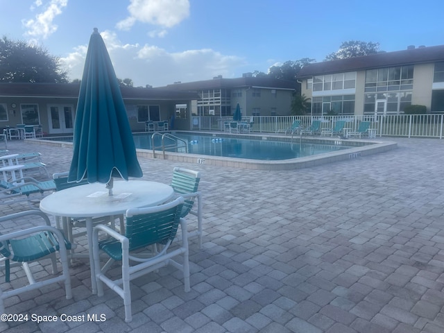 view of pool featuring a patio area