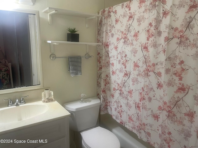 full bathroom featuring vanity, toilet, and shower / bath combo