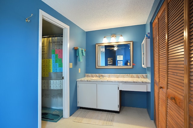 bathroom with vanity and a textured ceiling