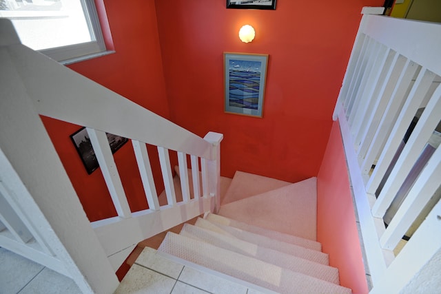 staircase featuring tile patterned floors