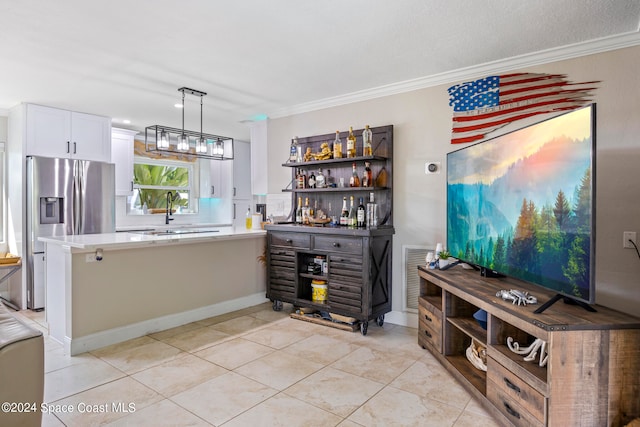 kitchen featuring ornamental molding, white cabinets, hanging light fixtures, and stainless steel refrigerator with ice dispenser