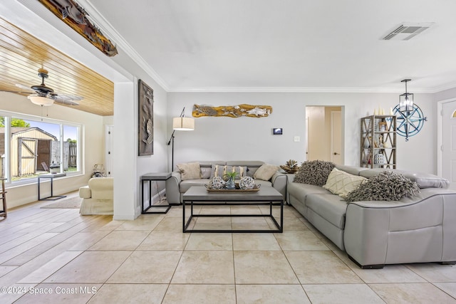 living area with baseboards, visible vents, a ceiling fan, ornamental molding, and light tile patterned floors