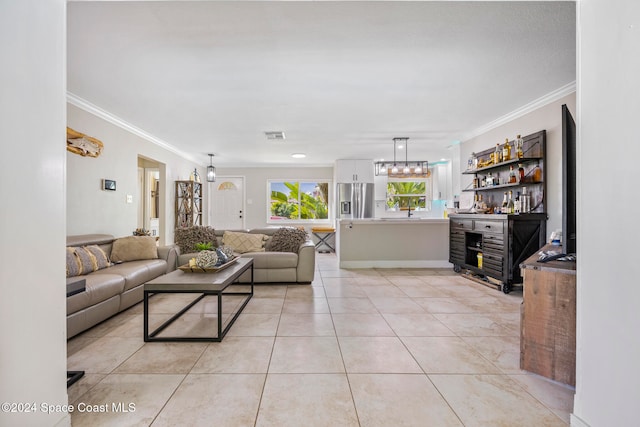 tiled living room featuring sink and crown molding