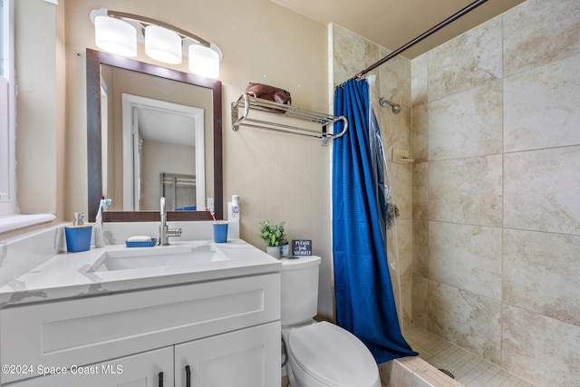 bathroom with vanity, a shower with curtain, and toilet