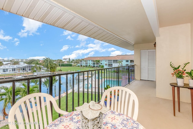 balcony featuring a water view