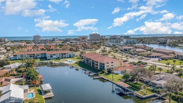 bird's eye view featuring a water view and a city view