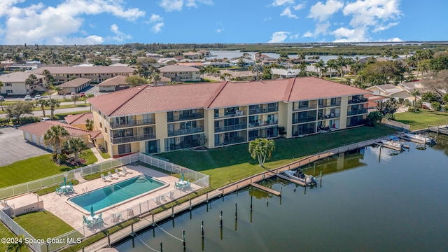 birds eye view of property with a water view
