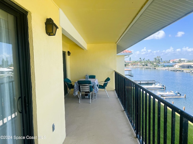 balcony featuring a water view