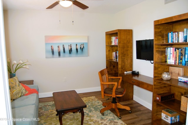 home office featuring baseboards, wood finished floors, and a ceiling fan