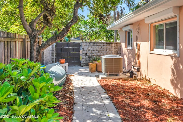 view of yard featuring cooling unit and a patio area