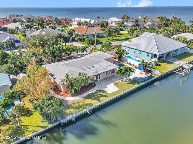 drone / aerial view with a water view