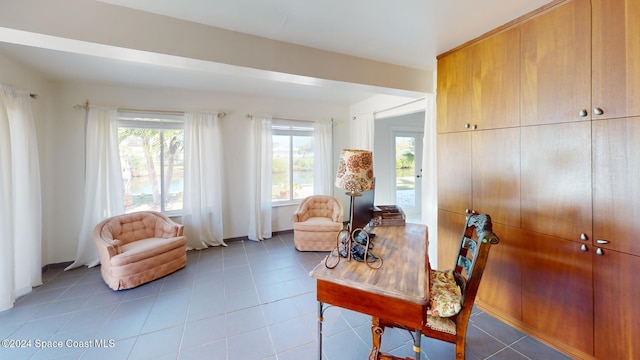 sitting room with light tile patterned floors