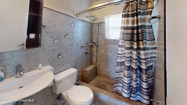 bathroom with tasteful backsplash, a shower with curtain, sink, tile walls, and toilet