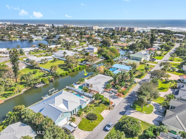 drone / aerial view with a water view