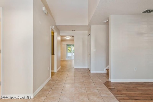 hallway featuring light hardwood / wood-style flooring