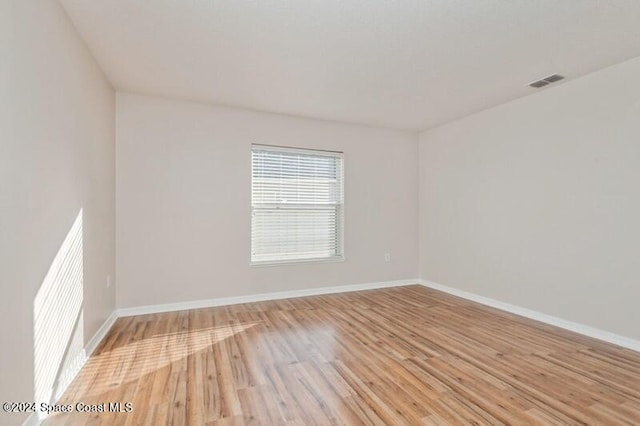 unfurnished room featuring light hardwood / wood-style flooring