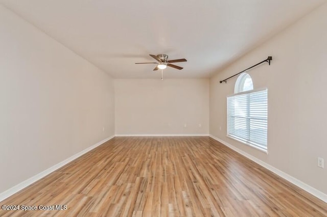 unfurnished room with light wood-type flooring and ceiling fan