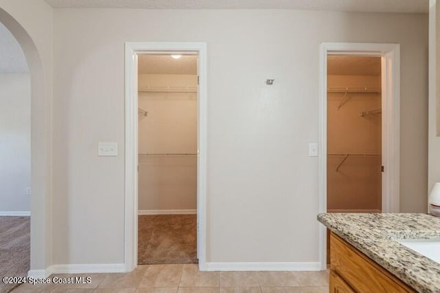 bathroom featuring vanity and tile patterned flooring