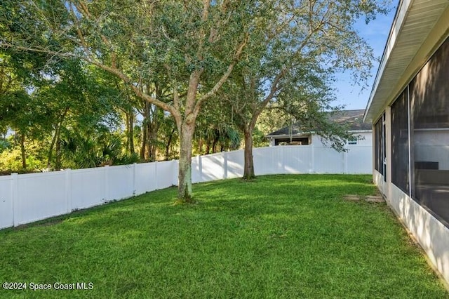 view of yard featuring a sunroom