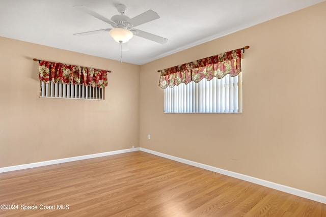 unfurnished room with wood-type flooring and ceiling fan