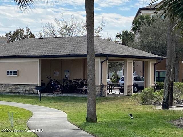 rear view of house with a yard