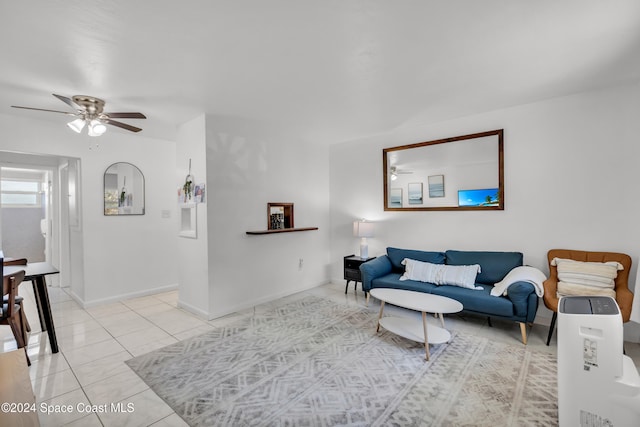 living room with ceiling fan and light tile patterned floors