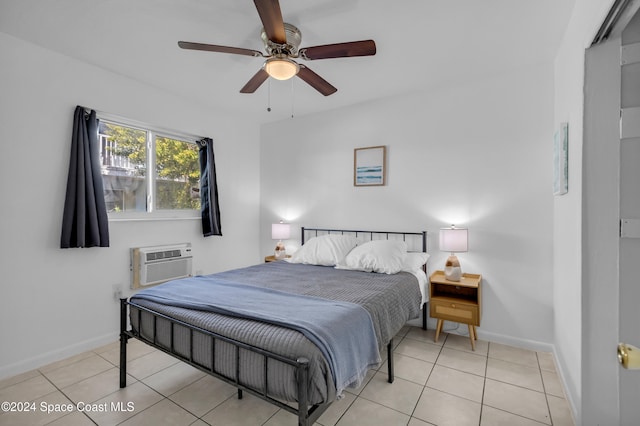 tiled bedroom with a wall mounted air conditioner and ceiling fan