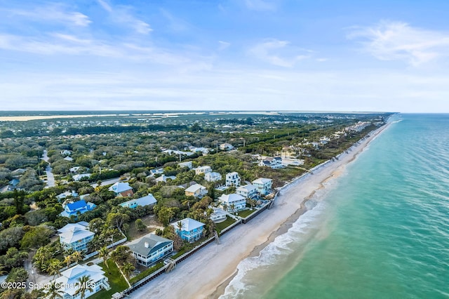 birds eye view of property with a view of the beach and a water view