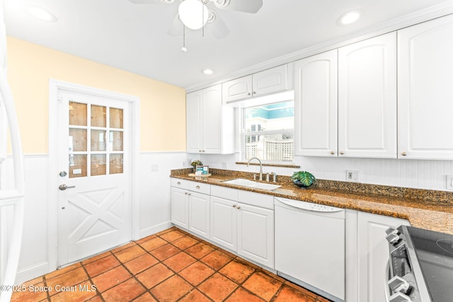 kitchen with sink, light tile patterned floors, white cabinetry, electric range, and white dishwasher