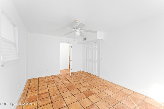 empty room featuring ceiling fan