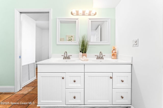 bathroom featuring tile patterned flooring and vanity