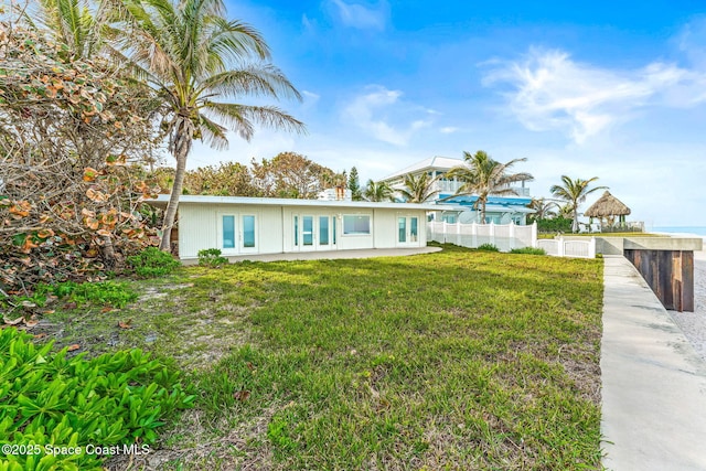 view of front of property featuring a gazebo and a front lawn