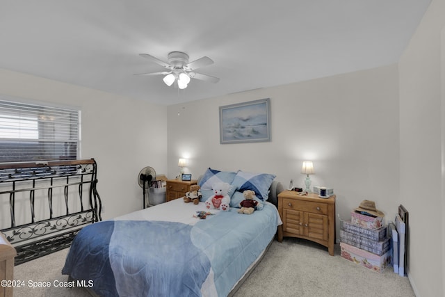 bedroom featuring ceiling fan and light colored carpet