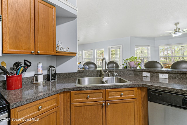 kitchen featuring stainless steel dishwasher, ceiling fan, kitchen peninsula, and sink