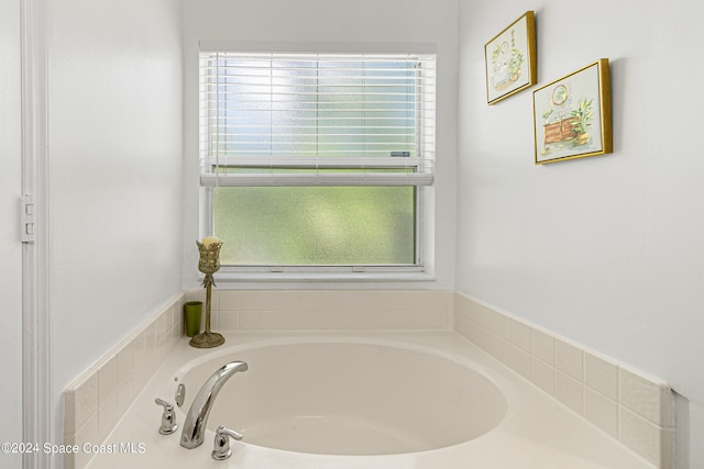 bathroom with a tub to relax in