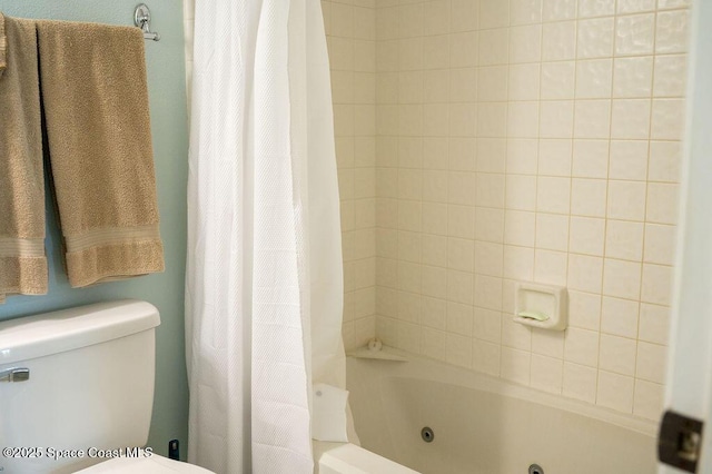 bathroom with shower / bath combination with curtain and toilet