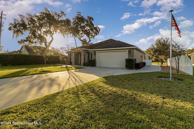 ranch-style house with a front lawn and a garage