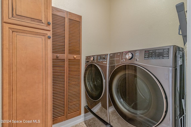 laundry room featuring separate washer and dryer