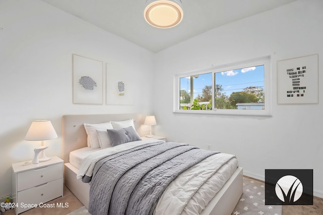 bedroom featuring light carpet