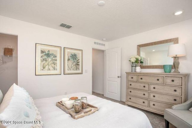 bedroom with visible vents