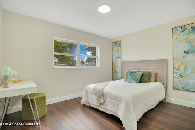 bedroom featuring dark wood-type flooring