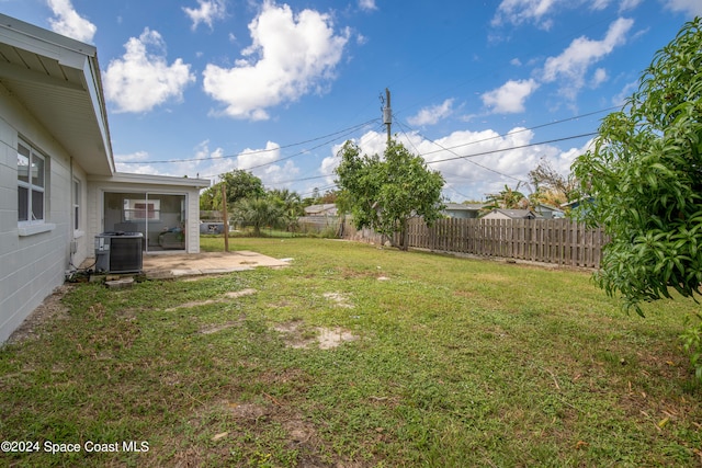 view of yard with a patio area and central AC